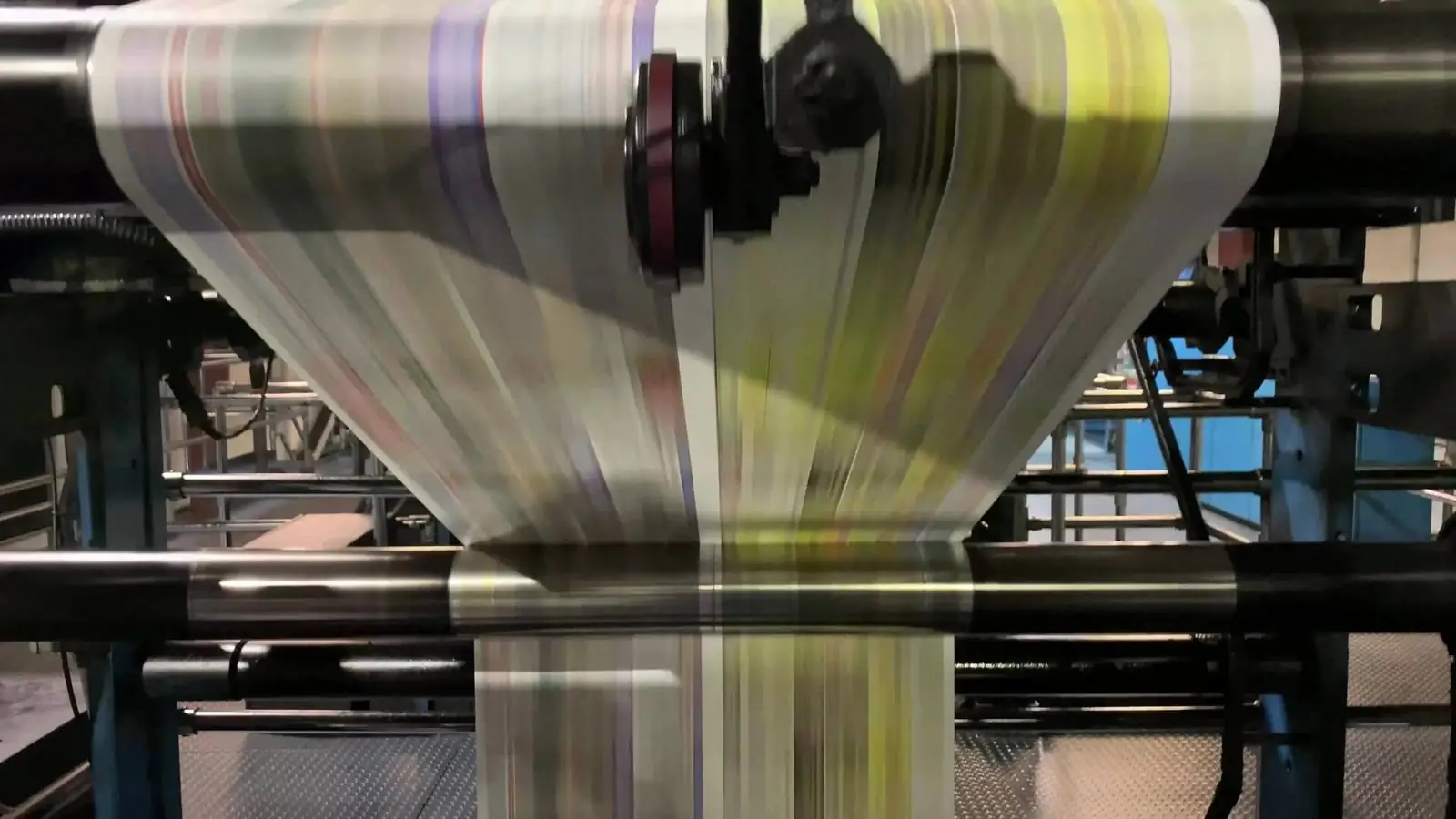 Newspaper presses several storeys tall running a print job